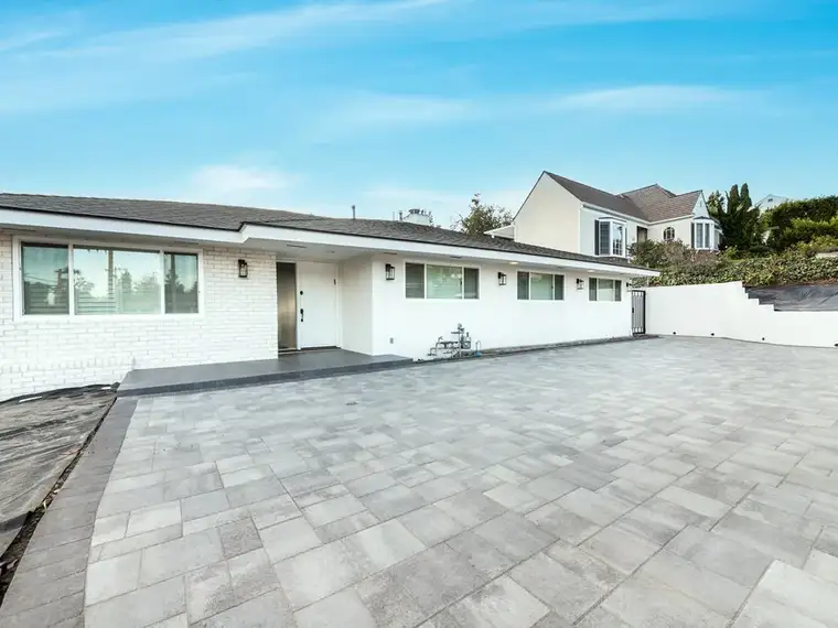 Full backyard remodel with paver patio and outdoor kitchen